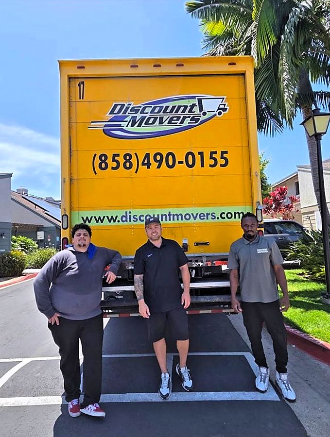 Discount Movers crew members loading a truck in San Diego